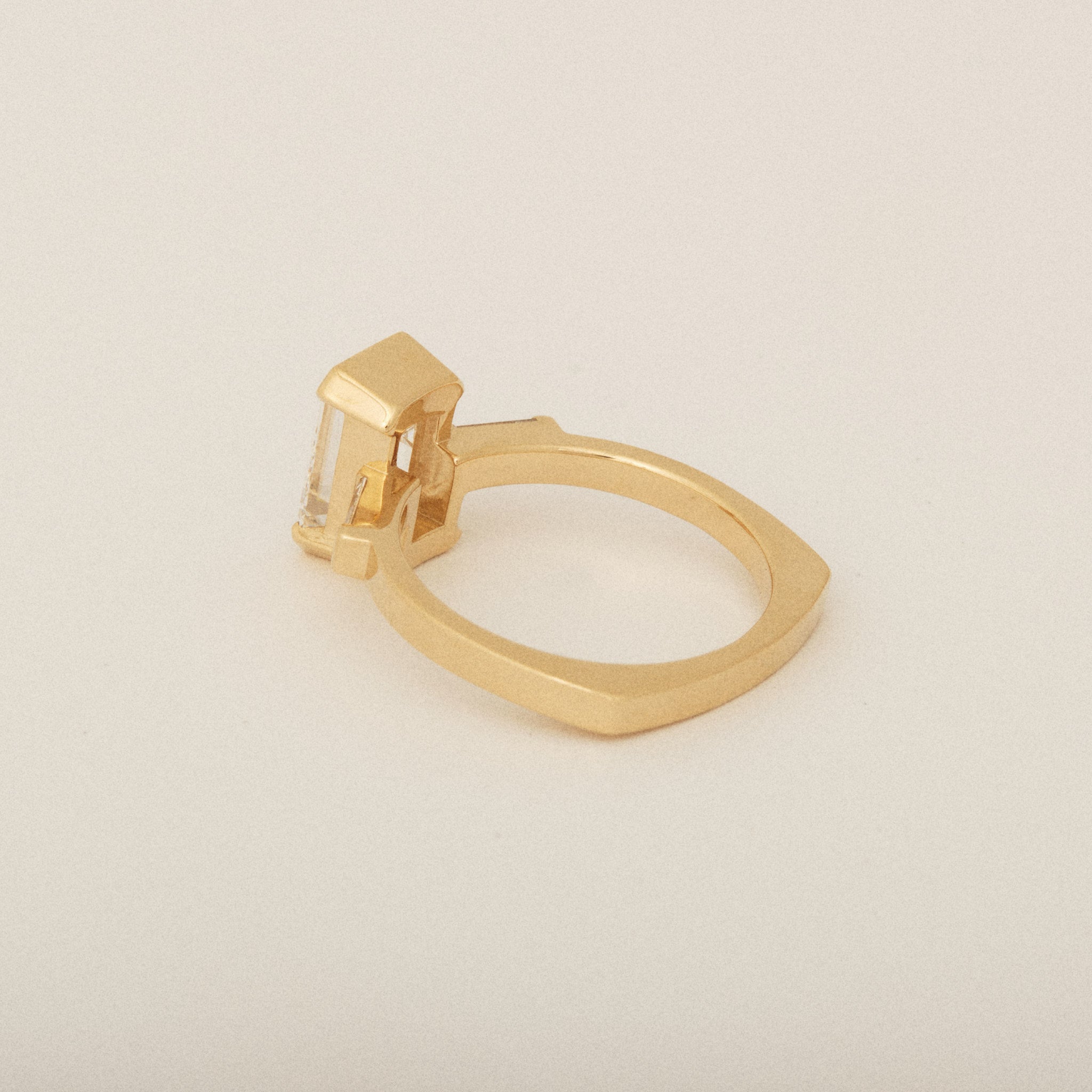 Emerald Cut Diamond Half Bezel Set with Two Baguette Sides Engagement Ring