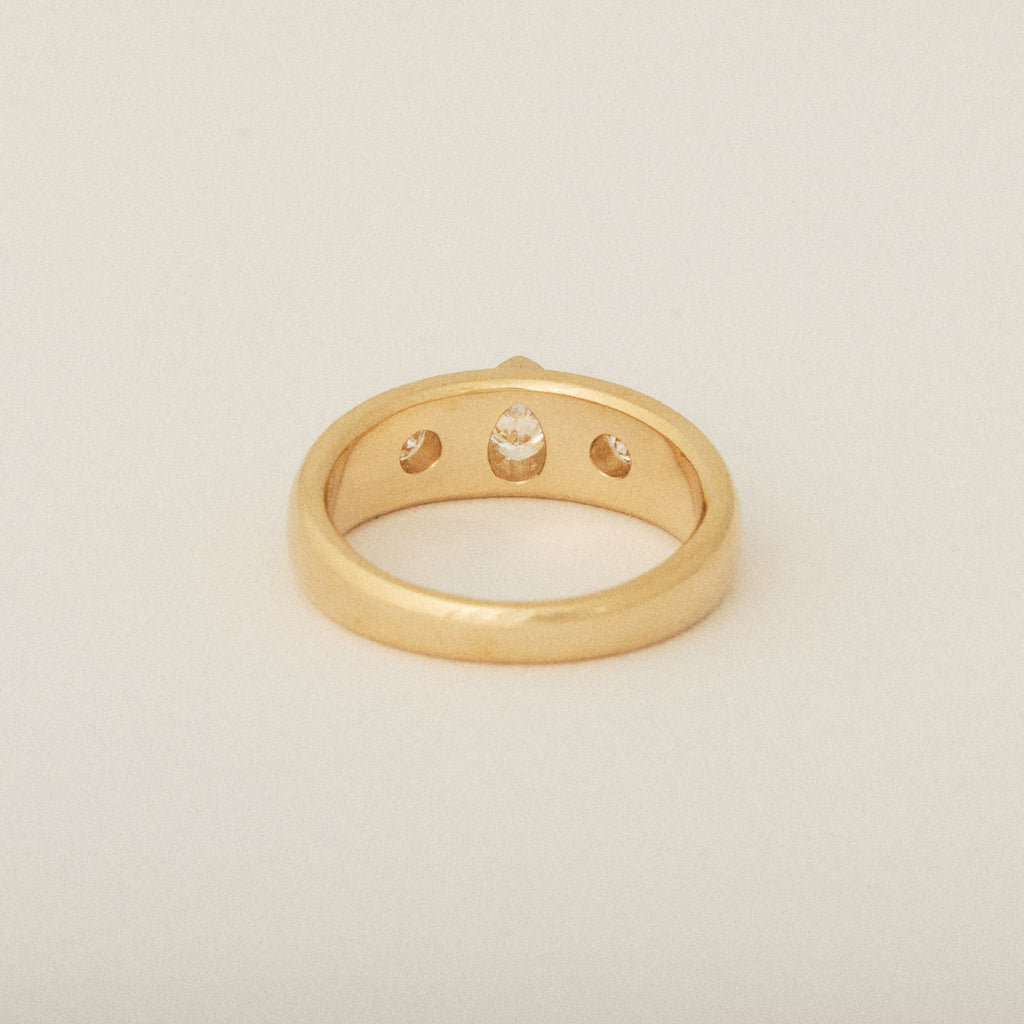 Three Heirloom Pear Shaped Diamonds in a Tapered Bezel Flush Set Engagement Ring