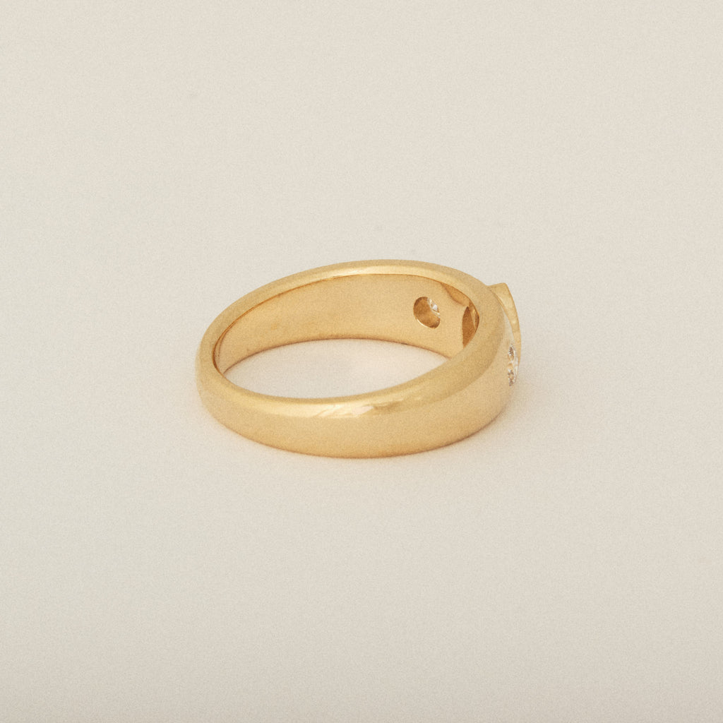 Three Heirloom Pear Shaped Diamonds in a Tapered Bezel Flush Set Engagement Ring