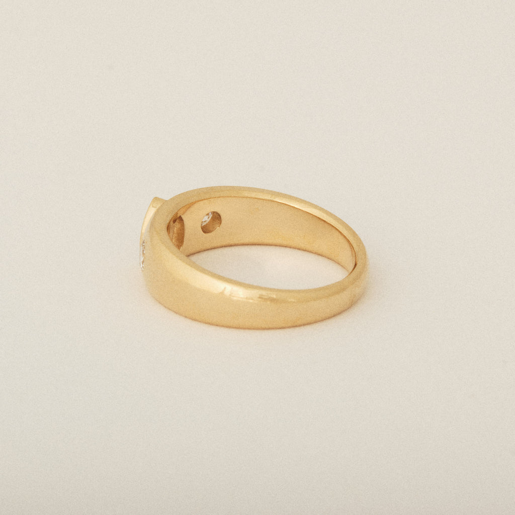 Three Heirloom Pear Shaped Diamonds in a Tapered Bezel Flush Set Engagement Ring