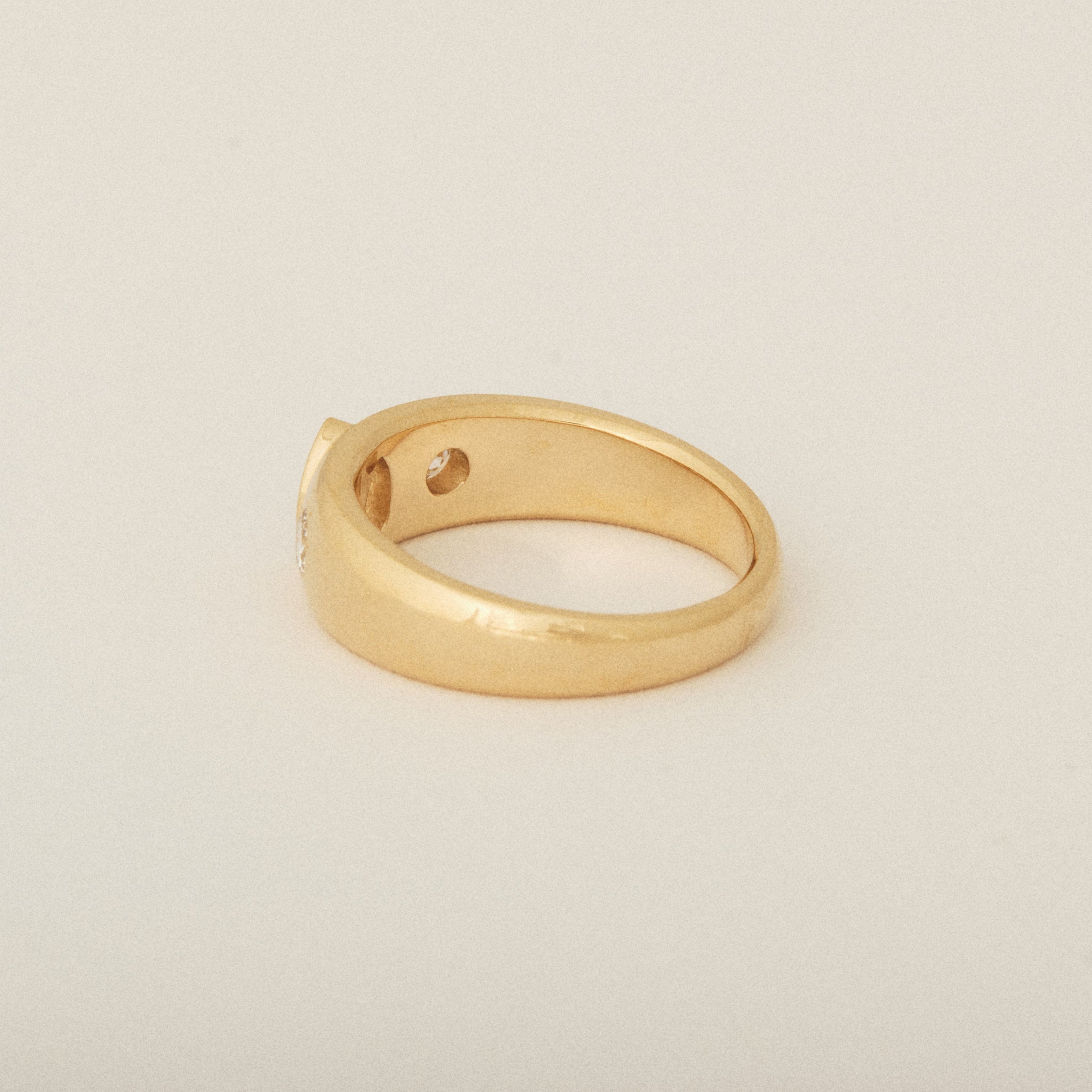 Three Heirloom Pear Shaped Diamonds in a Tapered Bezel Flush Set Engagement Ring