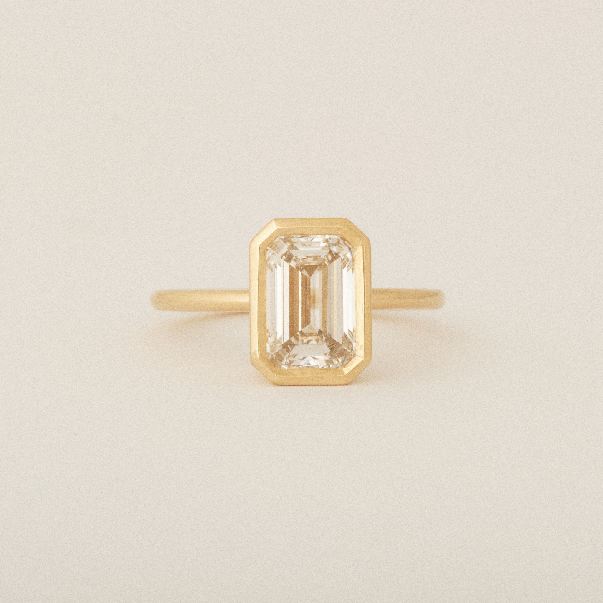 North South Emerald Cut Diamond Bezel Set Round Band 14k Yellow Gold Engagement Ring