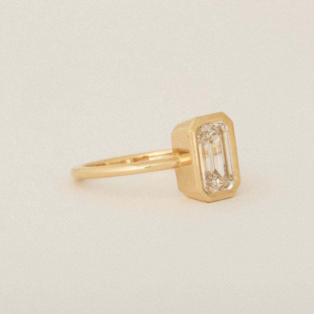 North South Emerald Cut Diamond Bezel Set Round Band 14k Yellow Gold Engagement Ring