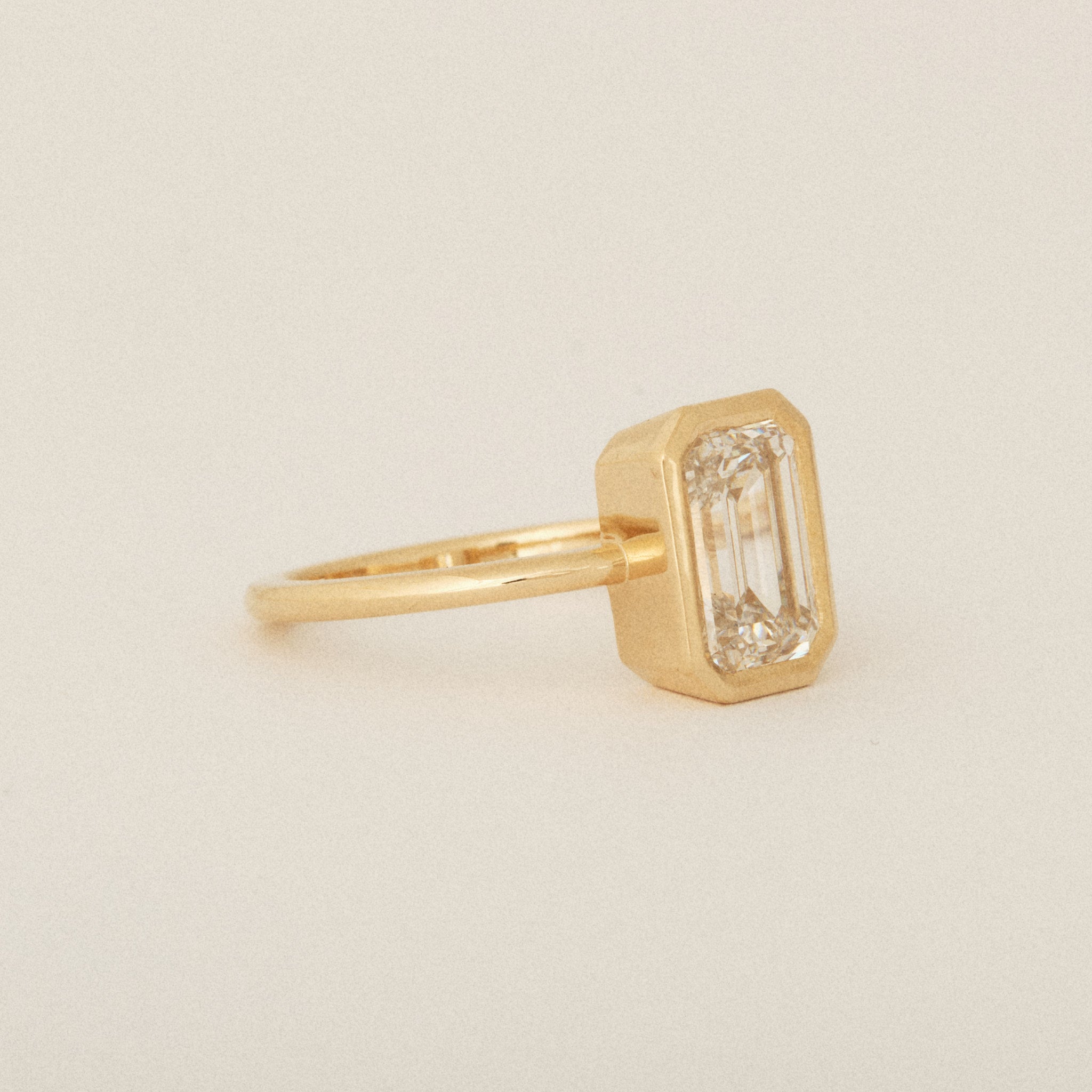 North South Emerald Cut Diamond Bezel Set Round Band 14k Yellow Gold Engagement Ring