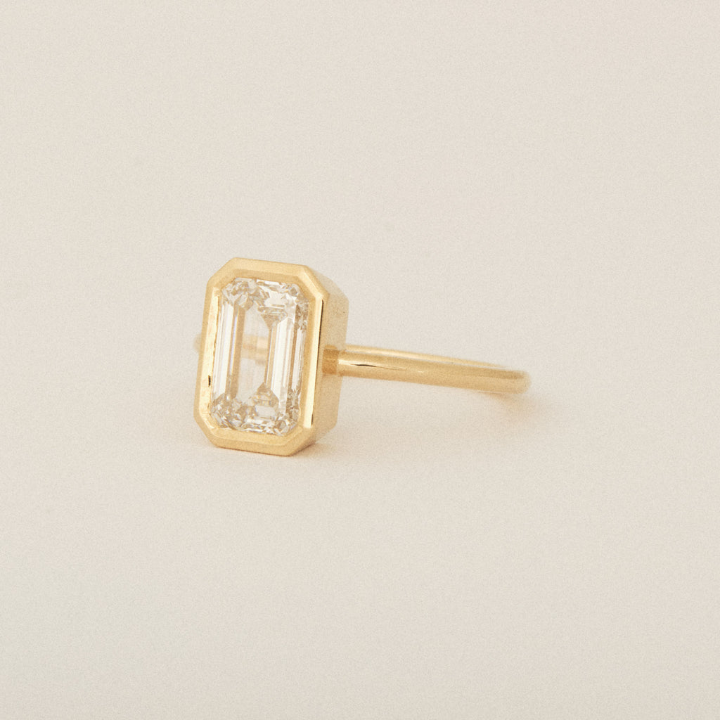North South Emerald Cut Diamond Bezel Set Round Band 14k Yellow Gold Engagement Ring
